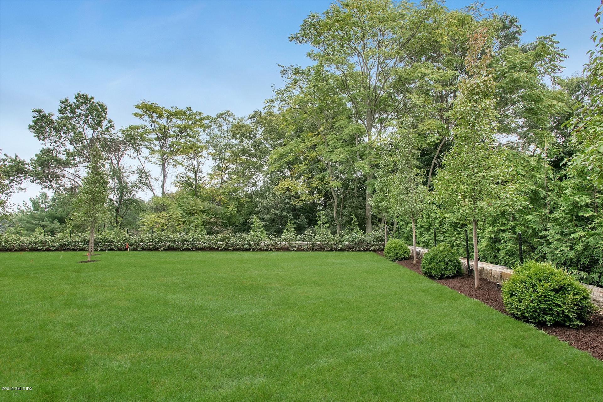 53 Sheep Hill Road Riverside, CT 06878 - Photo 10 of 10 a backyard of a house with lots of green space