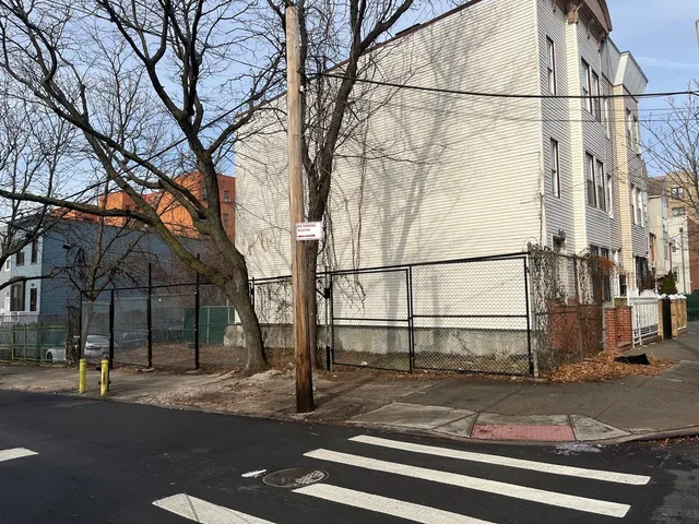 a view of a house with a street