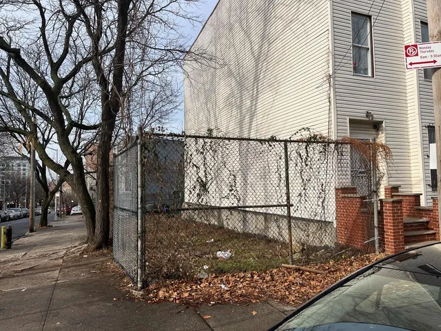 a view of a street with a tree