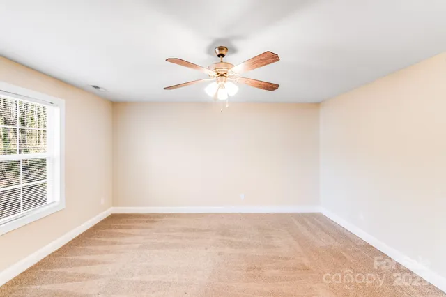 a view of a big room with carpet