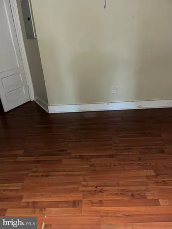 a view of room with wooden floor