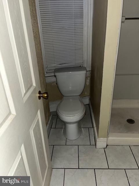 5634 Walnut Street Philadelphia, PA 19139 - Photo 10 of 13 a bathroom with a toilet and a shower