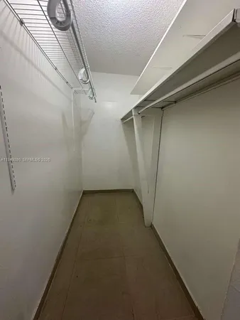a view of a room with racks on the wall