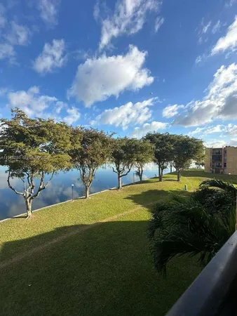 a view of a lake with houses in the back