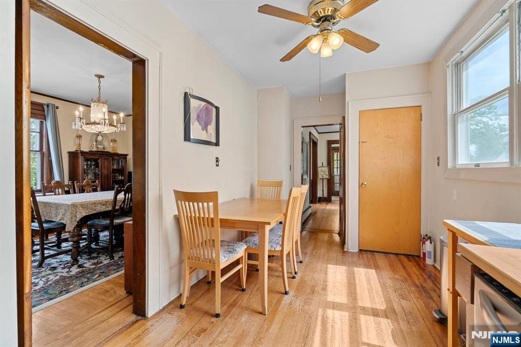 294 Sylvan Street Rutherford, NJ 07070 - Photo 13 of 29 a view of a dining room with furniture window and wooden floor