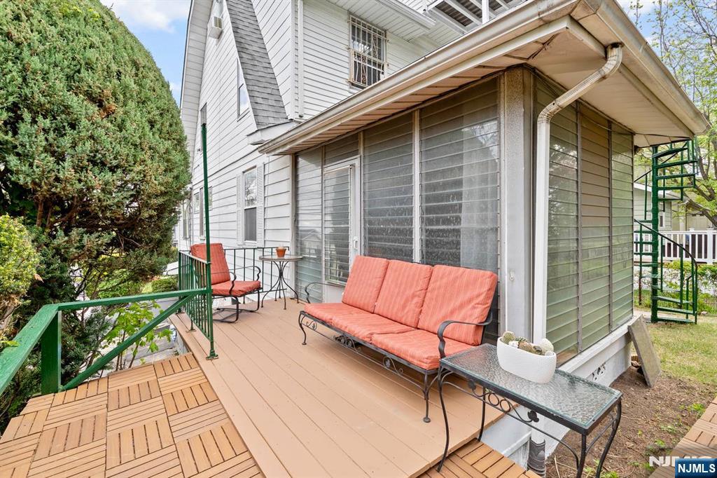 294 Sylvan Street Rutherford, NJ 07070 - Photo 23 of 29 a view of sitting area with furniture and wooden floor