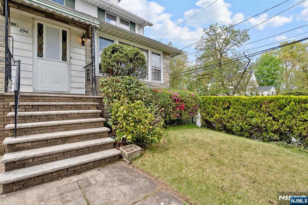 294 Sylvan Street Rutherford, NJ 07070 - Photo 3 of 29 a view of a house with a yard