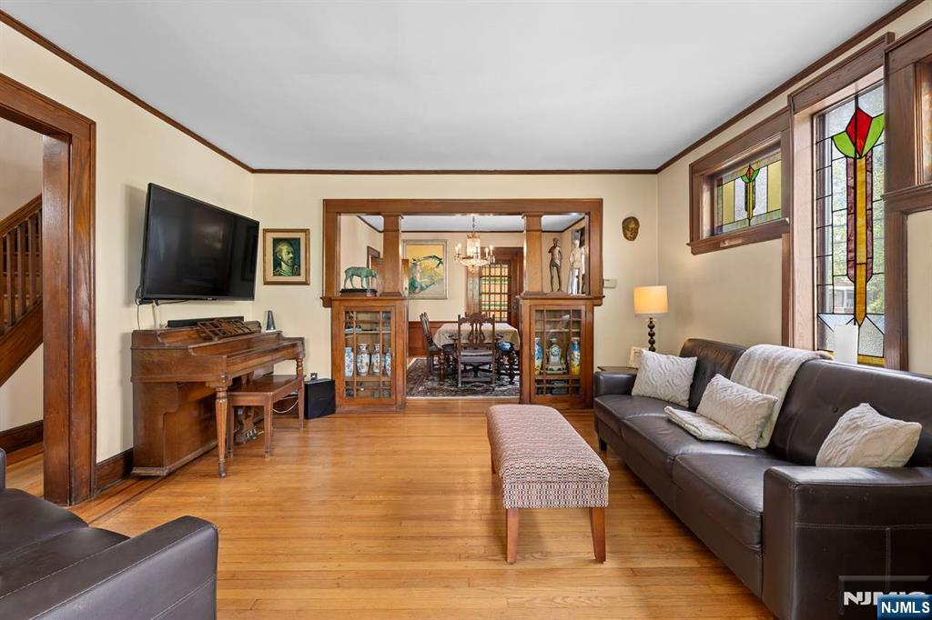 294 Sylvan Street Rutherford, NJ 07070 - Photo 6 of 29 a living room with furniture and a flat screen tv
