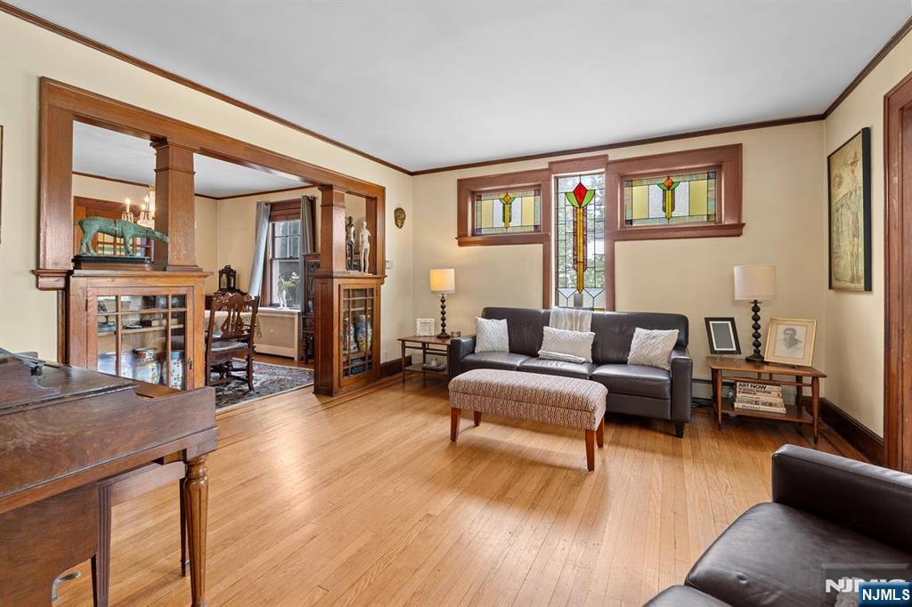 294 Sylvan Street Rutherford, NJ 07070 - Photo 7 of 29 a living room with furniture and a wooden floor