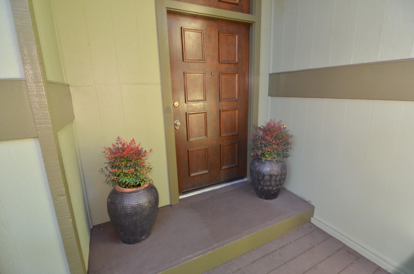 321 Middle Road Belmont, CA 94002 - Photo 2 of 17 a potted plant sitting in front of a door