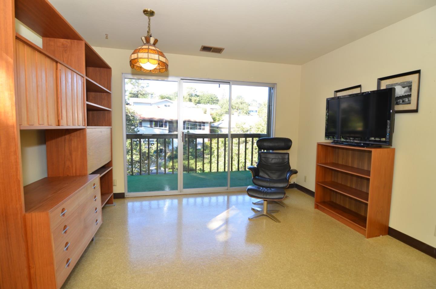 321 Middle Road Belmont, CA 94002 - Photo 6 of 17 a room with furniture and a flat screen tv