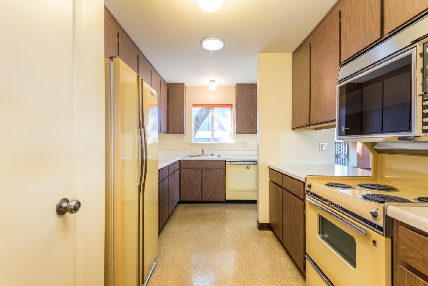321 Middle Road Belmont, CA 94002 - Photo 7 of 17 a kitchen with a sink stove and microwave
