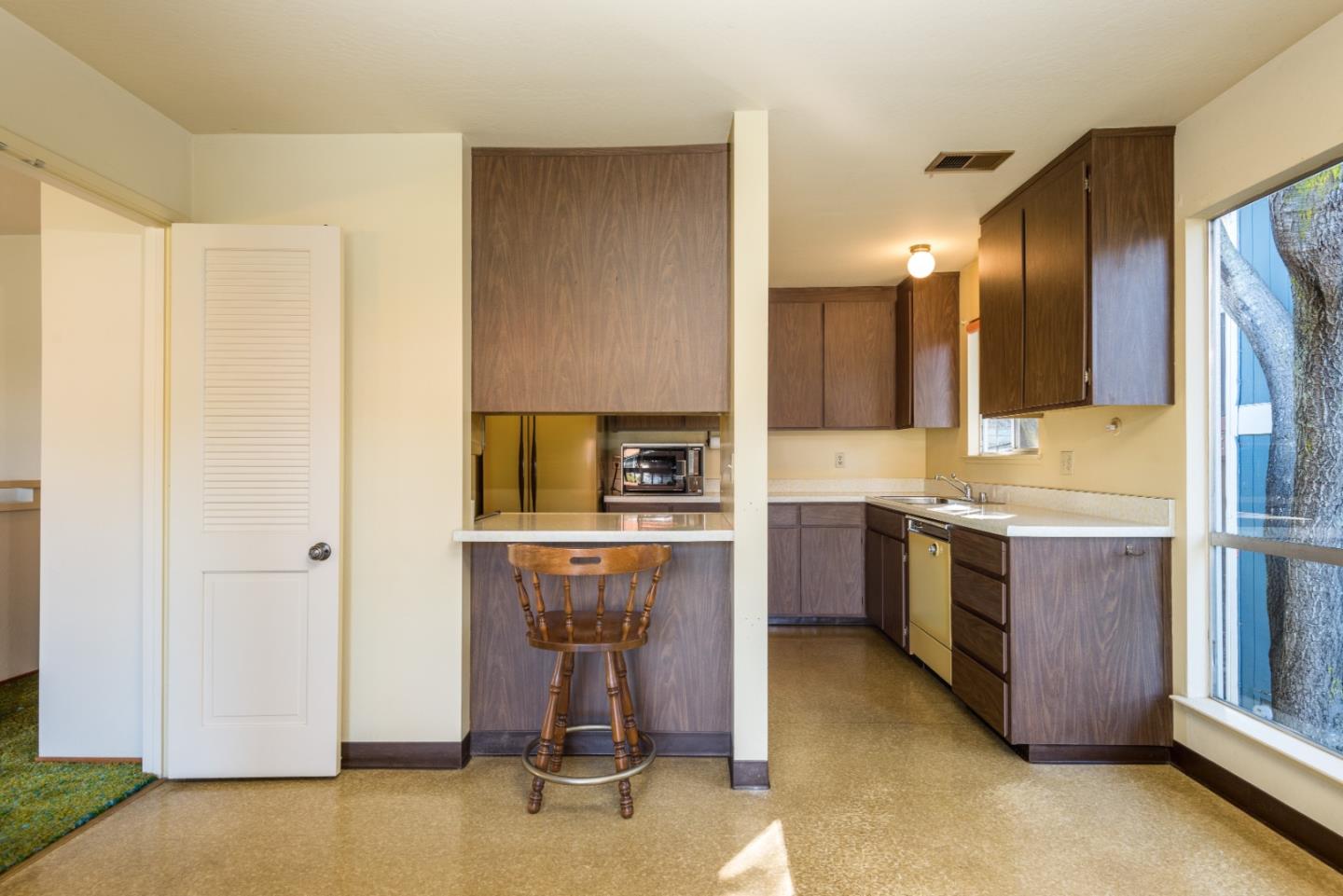 321 Middle Road Belmont, CA 94002 - Photo 8 of 17 a kitchen with a refrigerator sink and stove