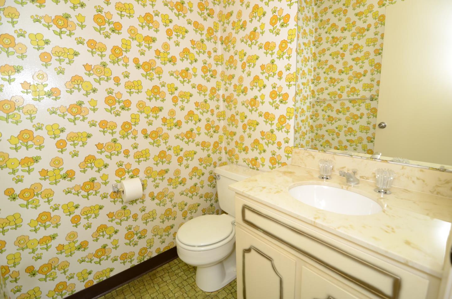 321 Middle Road Belmont, CA 94002 - Photo 9 of 17 a bathroom with a granite countertop toilet and a sink