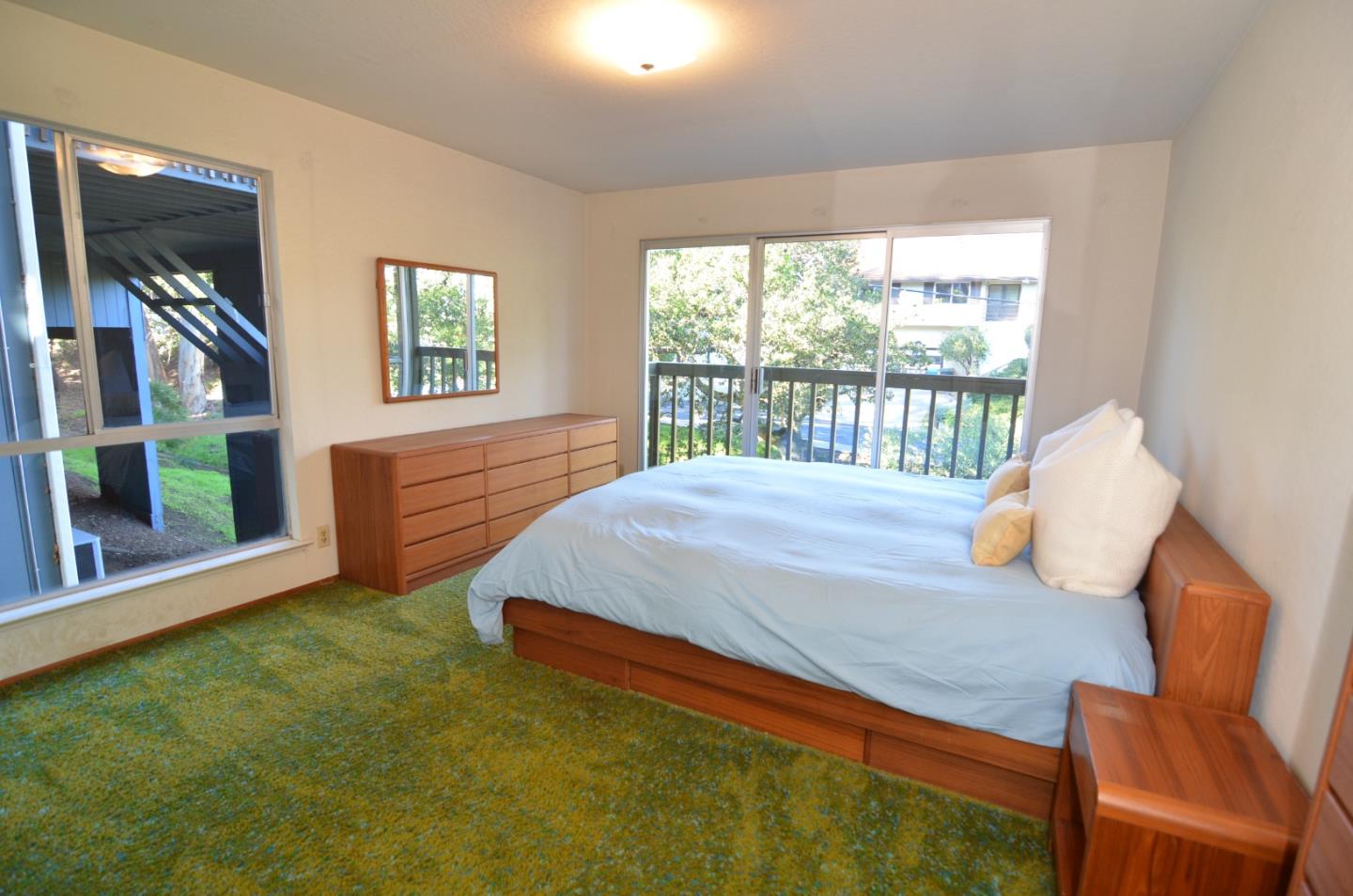 321 Middle Road Belmont, CA 94002 - Photo 10 of 17 a bedroom with a bed and a large window