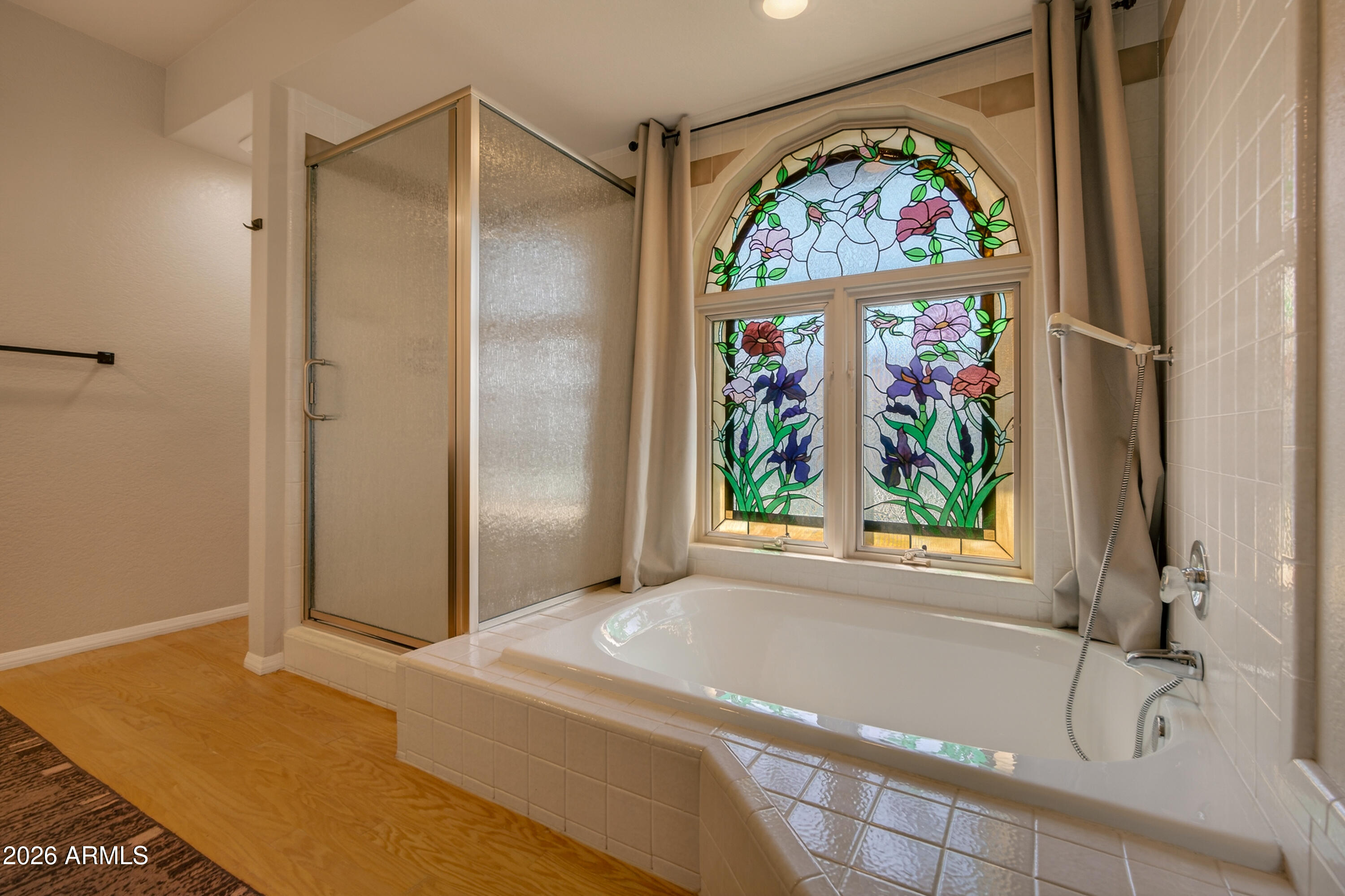 56 Red River Road Sedona, AZ 86351 - Photo 11 of 48 a bathroom with a tub and a window