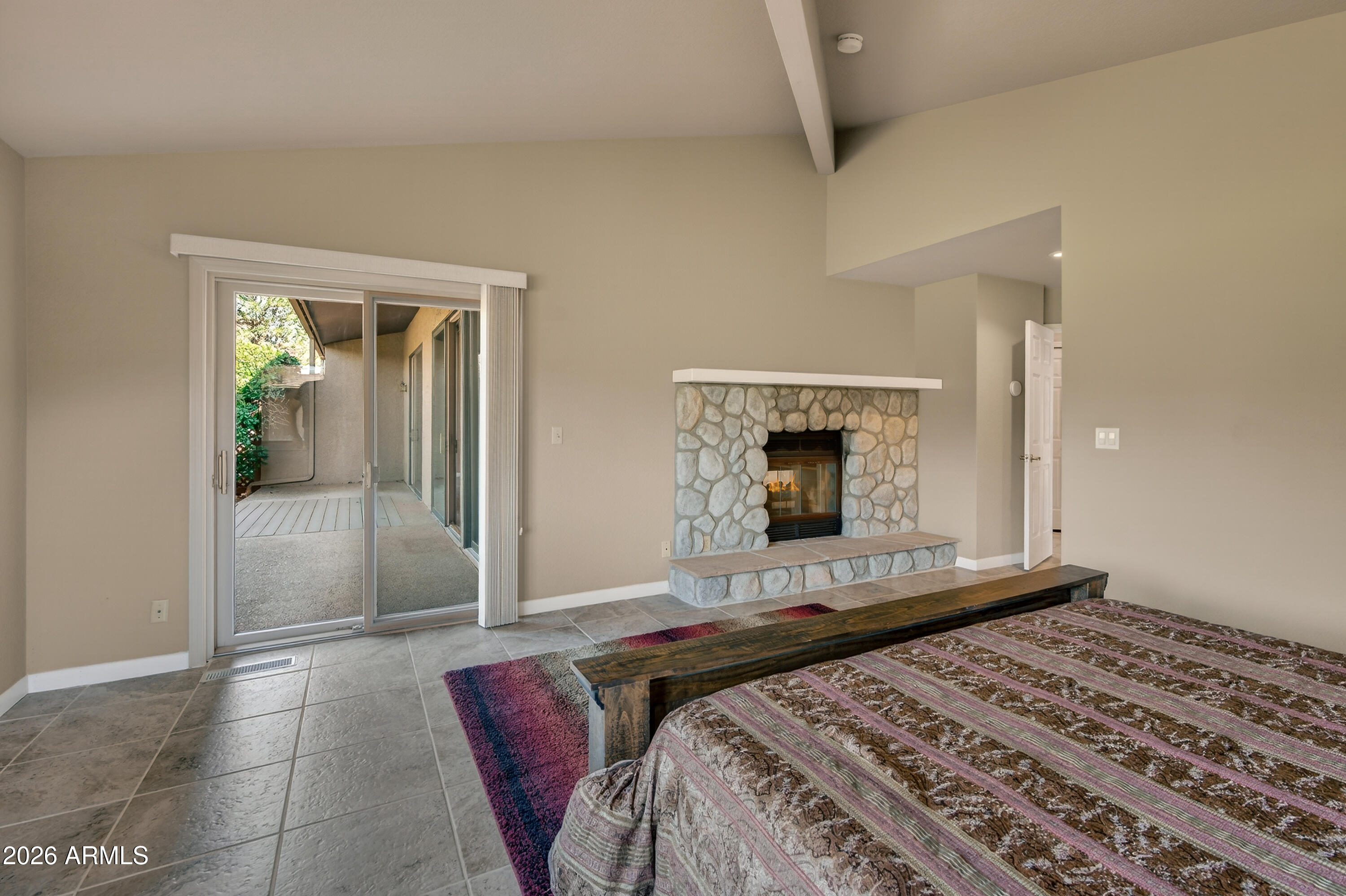 56 Red River Road Sedona, AZ 86351 - Photo 13 of 48 a bedroom with a bed and a mirror