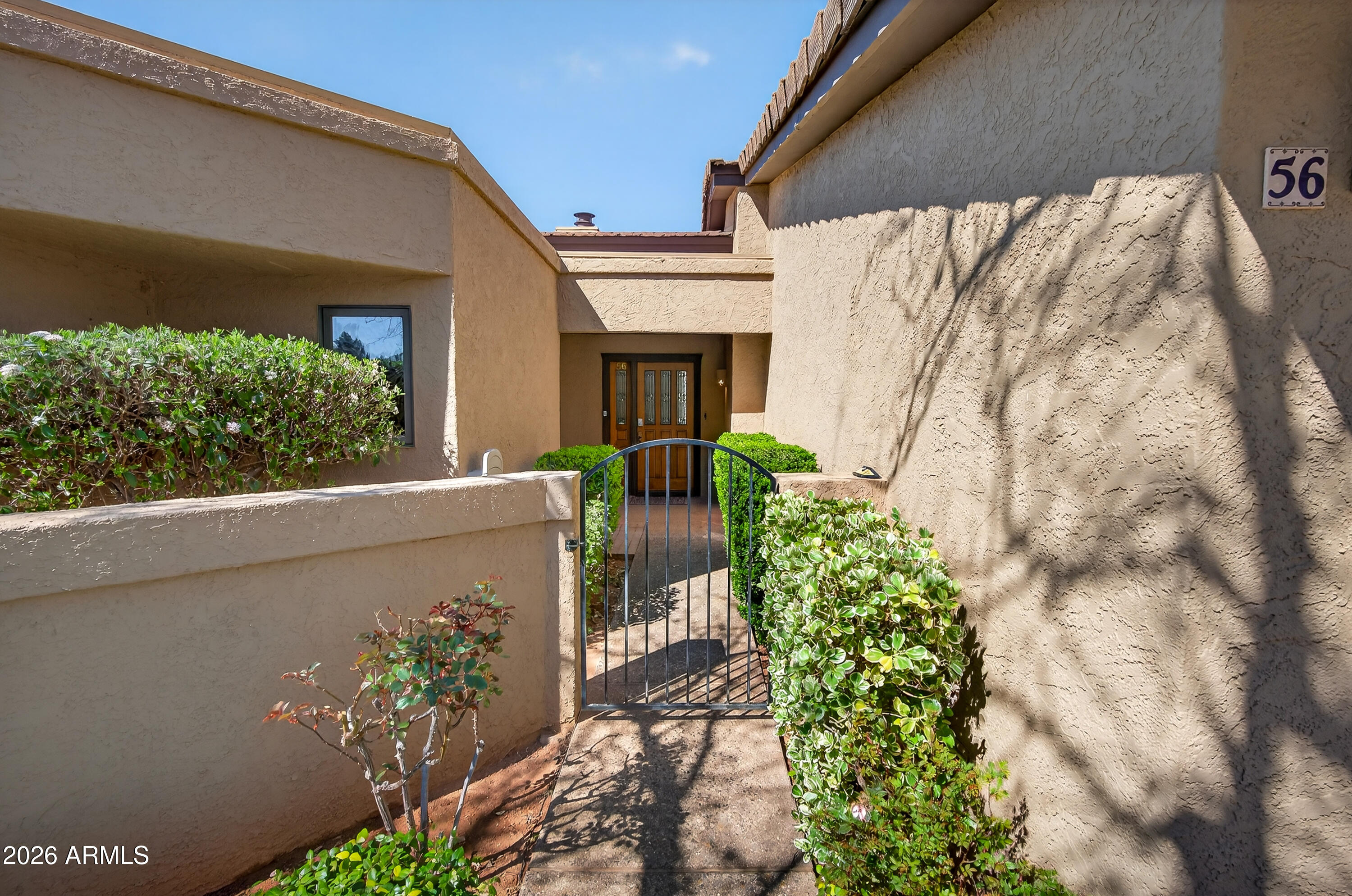56 Red River Road Sedona, AZ 86351 - Photo 28 of 48 a front view of a house with a yard