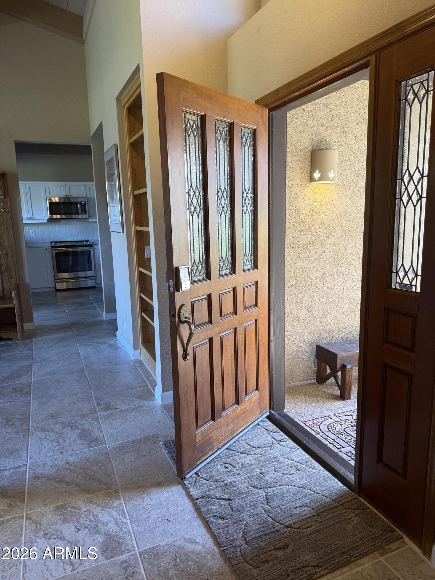 56 Red River Road Sedona, AZ 86351 - Photo 34 of 48 a view of a hallway to a livingroom with furniture
