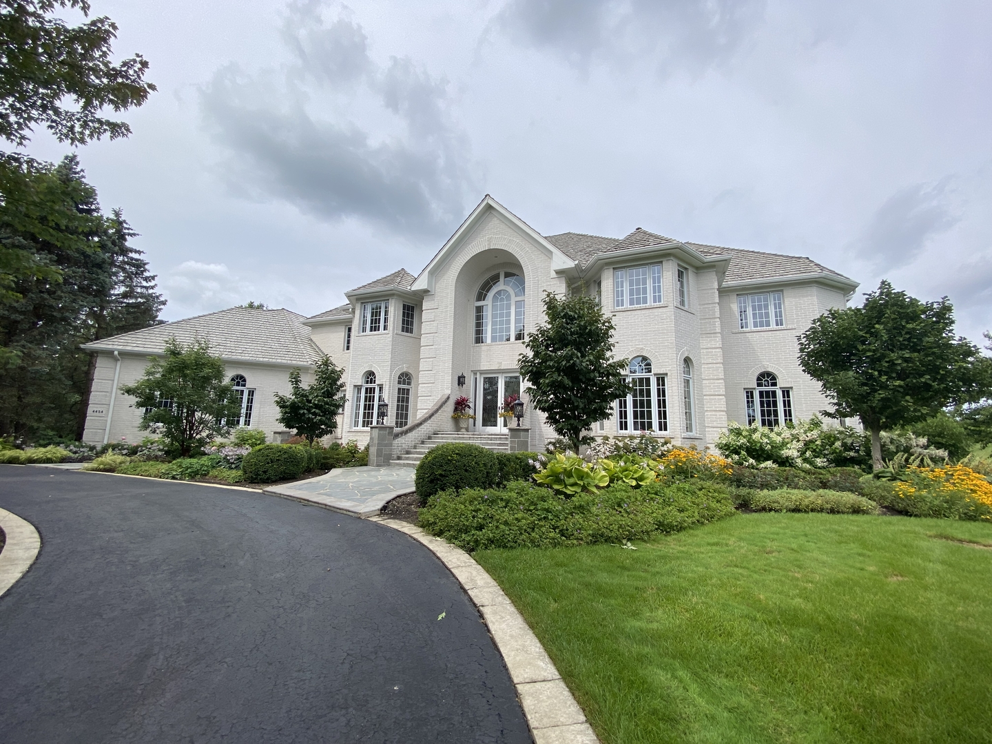 4454 Kettering Drive Long Grove, IL 60047 - Photo 1 of 44 a front view of a house with a yard and garage