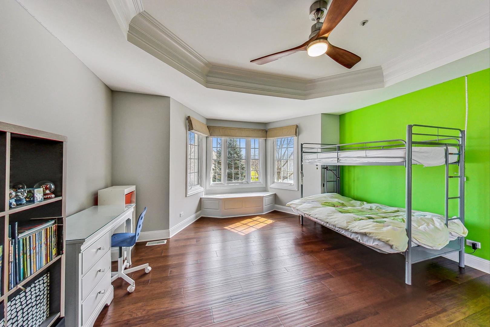 4454 Kettering Drive Long Grove, IL 60047 - Photo 23 of 44 a bedroom with furniture and a large window