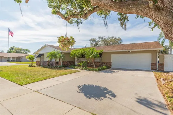 a view of a house with basketball court
