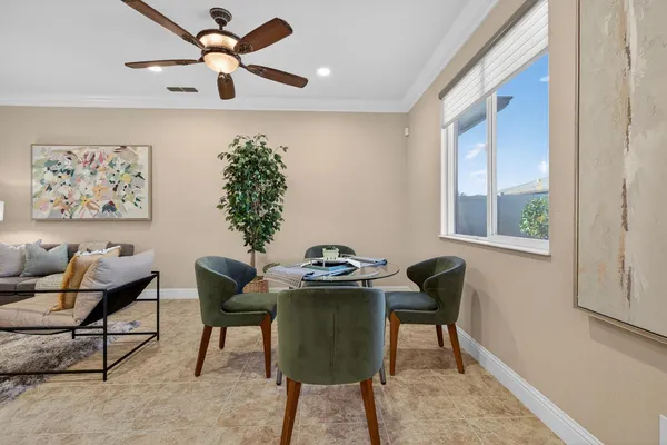 a kitchen with stainless steel appliances granite countertop a refrigerator a sink dishwasher a stove and a refrigerator with wooden floor