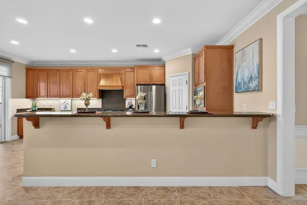 a large kitchen with stainless steel appliances kitchen island granite countertop a large counter top stainless steel appliances and cabinets