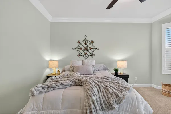 a spacious bedroom with a bed and a table