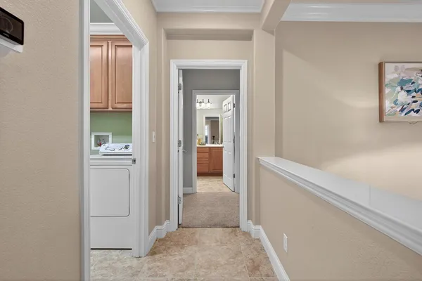 a bathroom with a double vanity sink mirror and shower