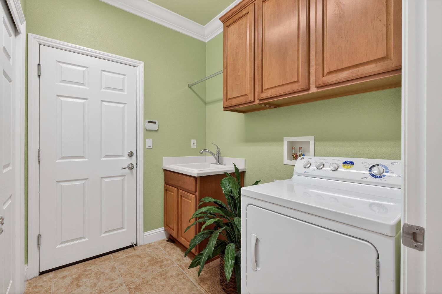 2379 Pepper Tree Lane Manteca, CA 95336 - Photo 32 of 61 LAUNDRY ROOM AT GARAGE ENTRANCE - DRYER INCLUDED