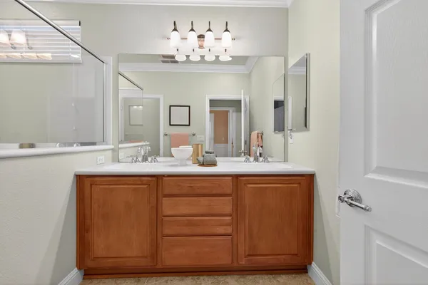 a view of a house with porch and garden