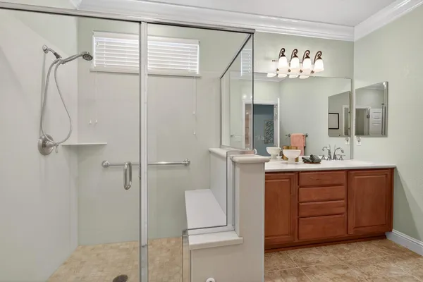 a front view of a house with a flower garden