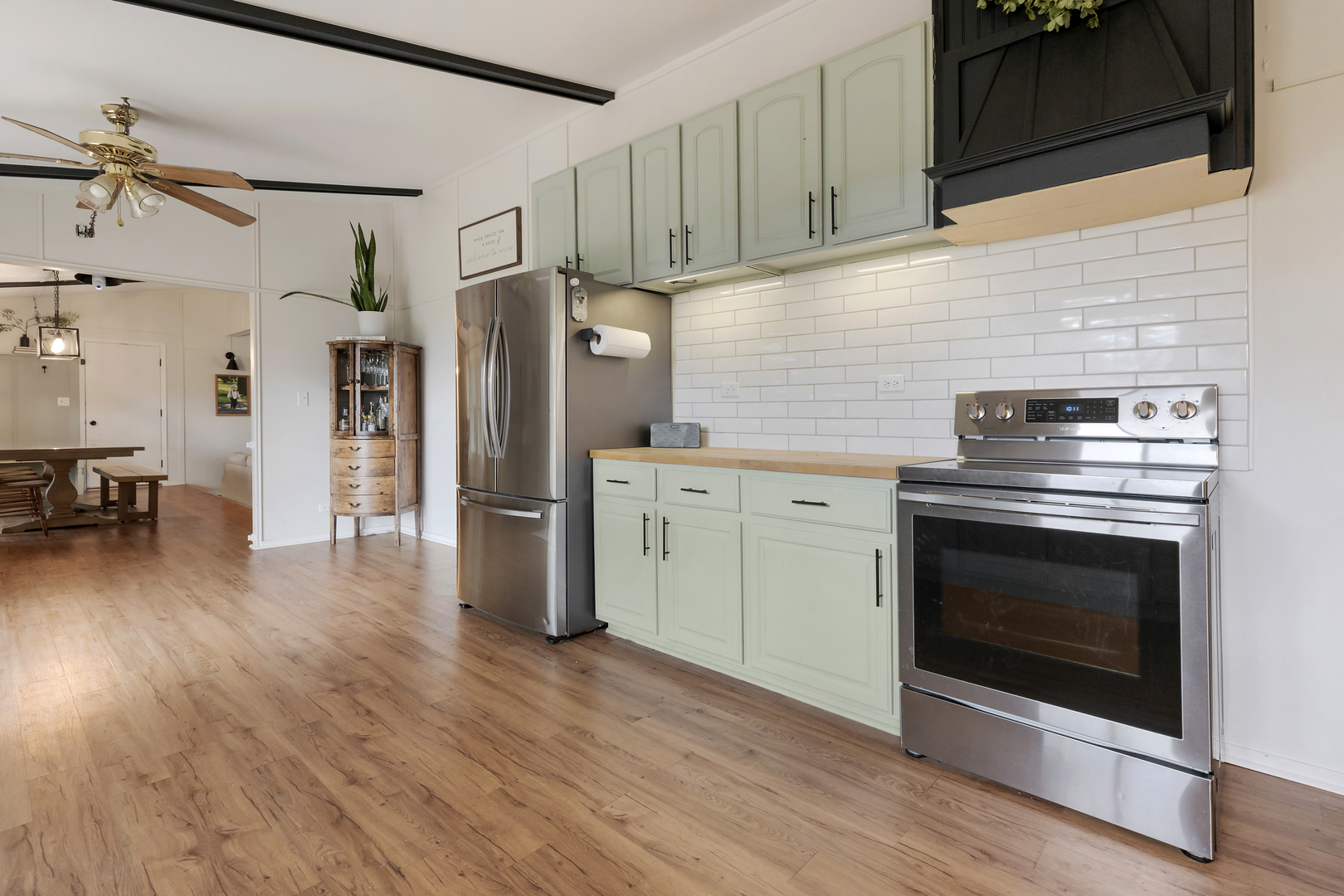 6610 Cherry Valley Road Kingston, IL 60145 - Photo 13 of 37 a kitchen with a stove and a refrigerator