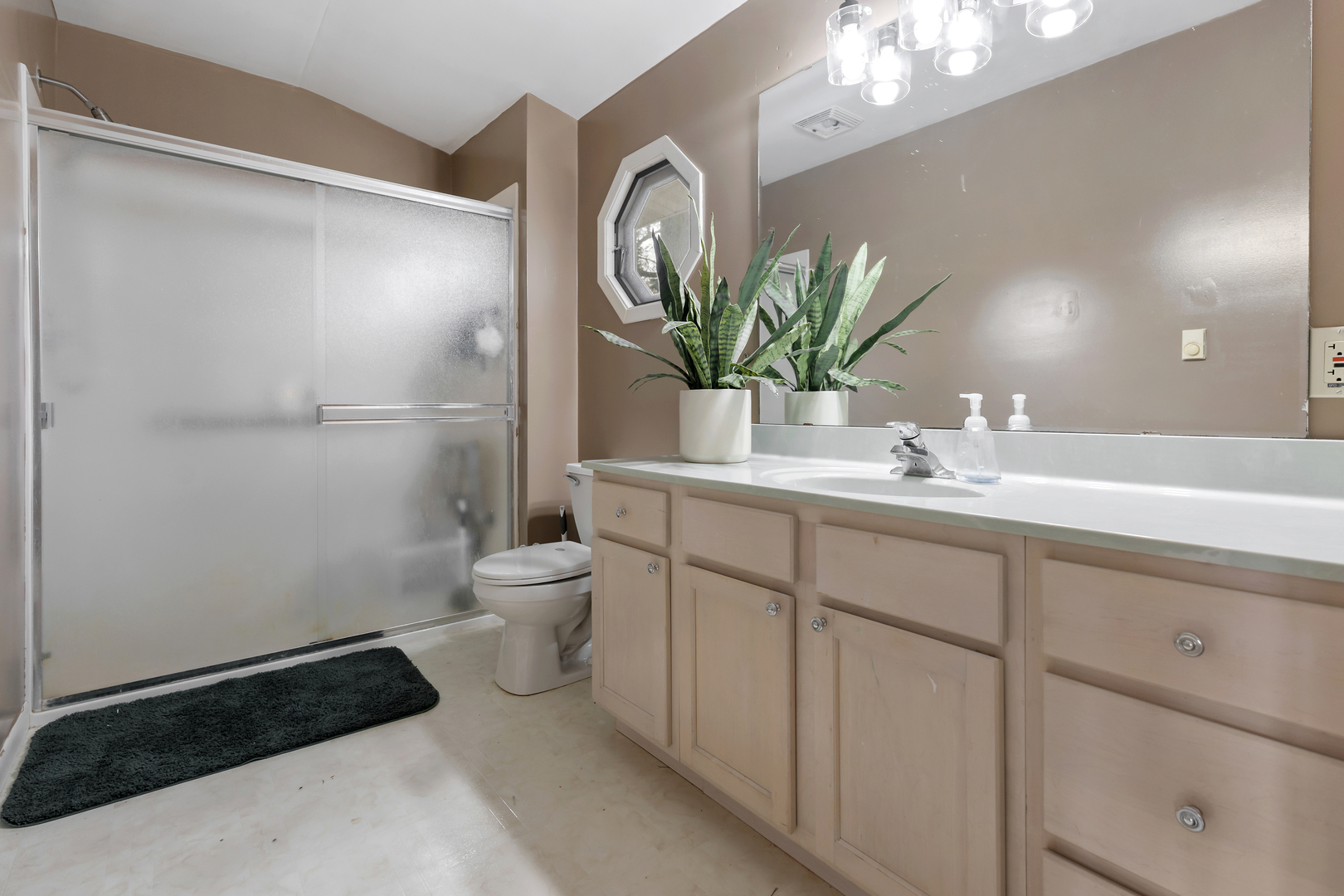 6610 Cherry Valley Road Kingston, IL 60145 - Photo 20 of 37 a bathroom with a toilet a sink and mirror