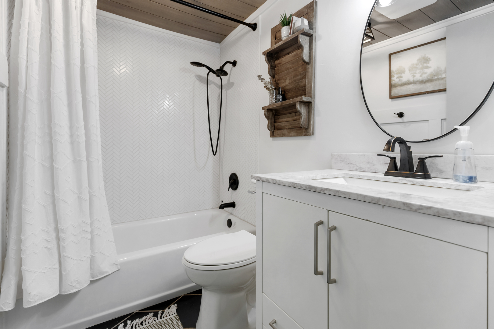 6610 Cherry Valley Road Kingston, IL 60145 - Photo 26 of 37 a bathroom with a granite countertop sink mirror toilet and bathtub
