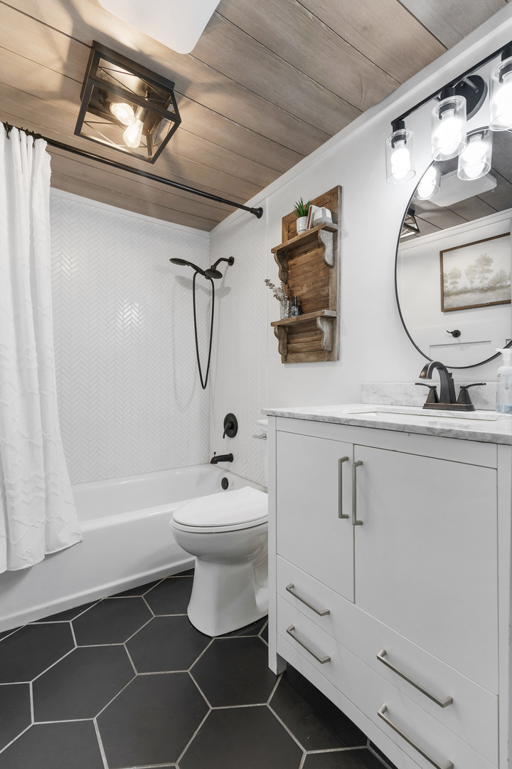 6610 Cherry Valley Road Kingston, IL 60145 - Photo 27 of 37 a bathroom with a toilet sink and mirror