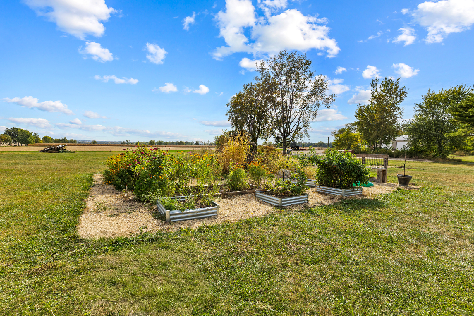 6610 Cherry Valley Road Kingston, IL 60145 - Photo 31 of 37 a view of a lake with a garden