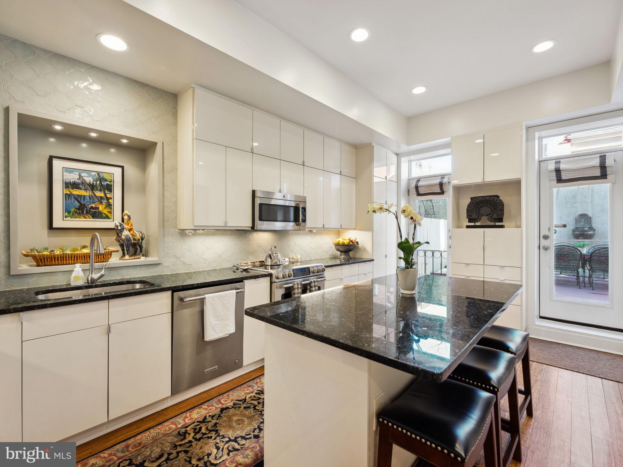 2001 19th Street Northwest, Unit 4 Washington, DC 20009 - Photo 12 of 42 a large kitchen with granite countertop lots of counter space and breakfast area