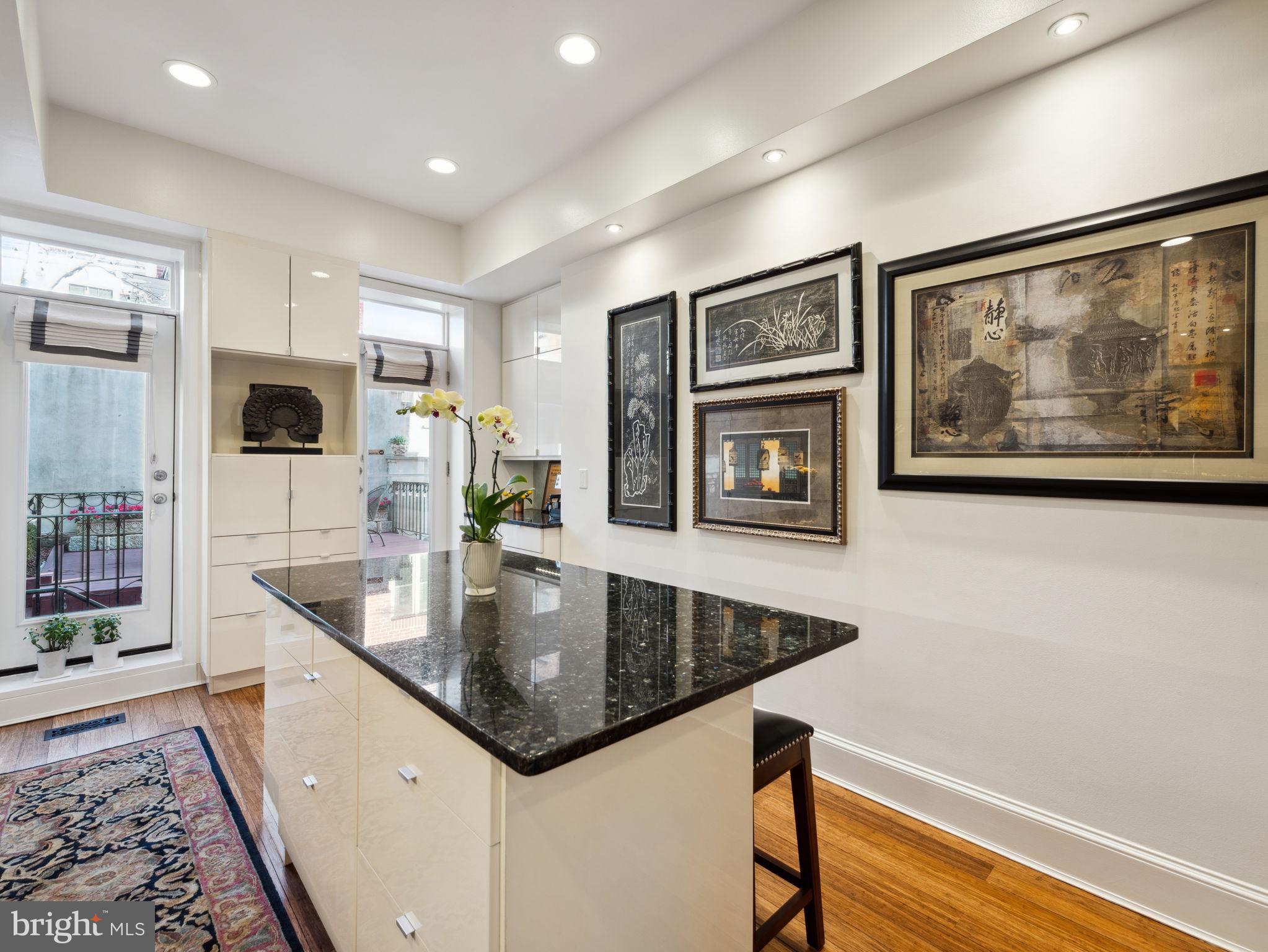 2001 19th Street Northwest, Unit 4 Washington, DC 20009 - Photo 15 of 42 a kitchen with stainless steel appliances granite countertop a sink and a refrigerator