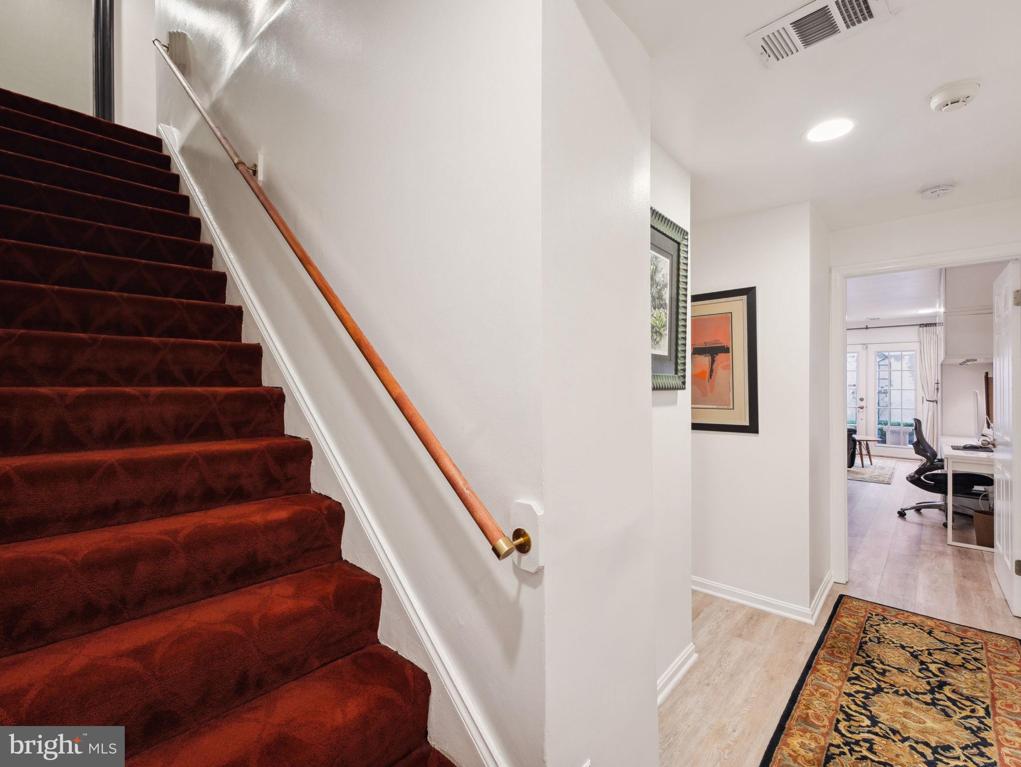 2001 19th Street Northwest, Unit 4 Washington, DC 20009 - Photo 20 of 42 a view of entryway and hall with wooden floor