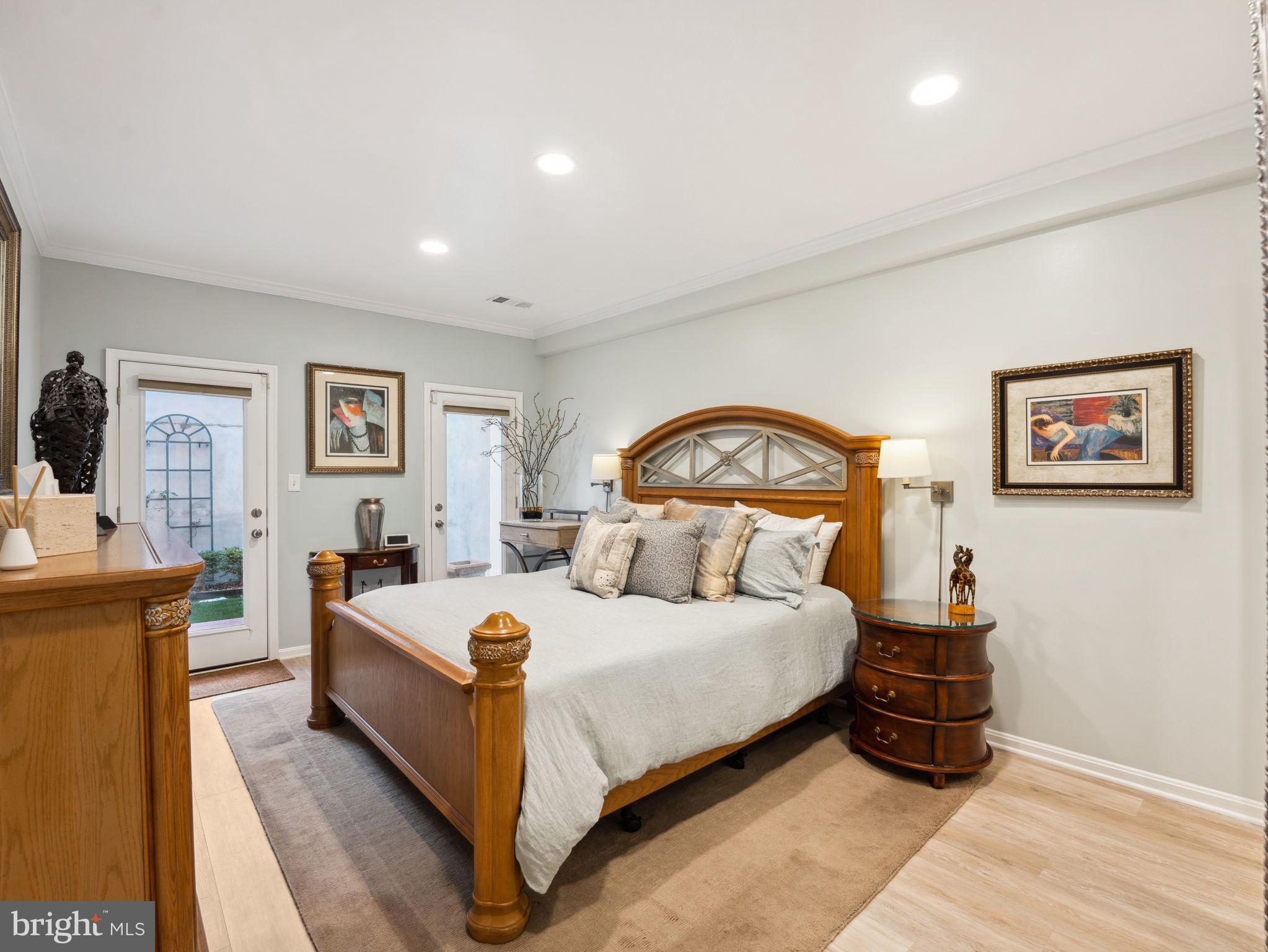 2001 19th Street Northwest, Unit 4 Washington, DC 20009 - Photo 21 of 42 a bedroom with a bed and a chandelier