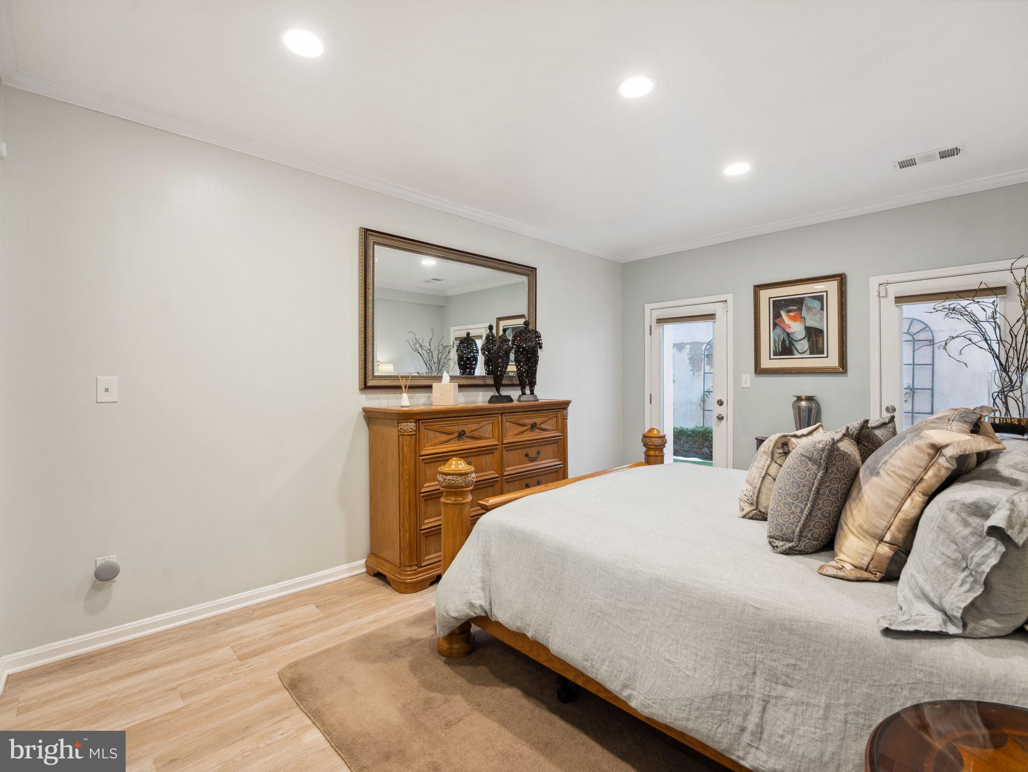 2001 19th Street Northwest, Unit 4 Washington, DC 20009 - Photo 22 of 42 a bedroom with a bed and a dresser