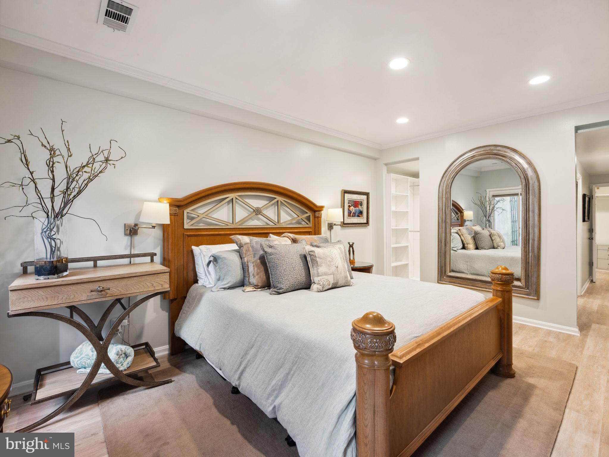 2001 19th Street Northwest, Unit 4 Washington, DC 20009 - Photo 23 of 42 a bed room with a bed and a chair