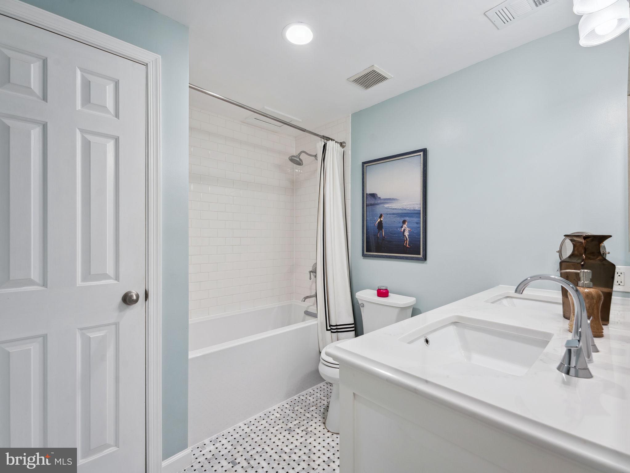 2001 19th Street Northwest, Unit 4 Washington, DC 20009 - Photo 25 of 42 a bathroom with a sink a toilet and shower