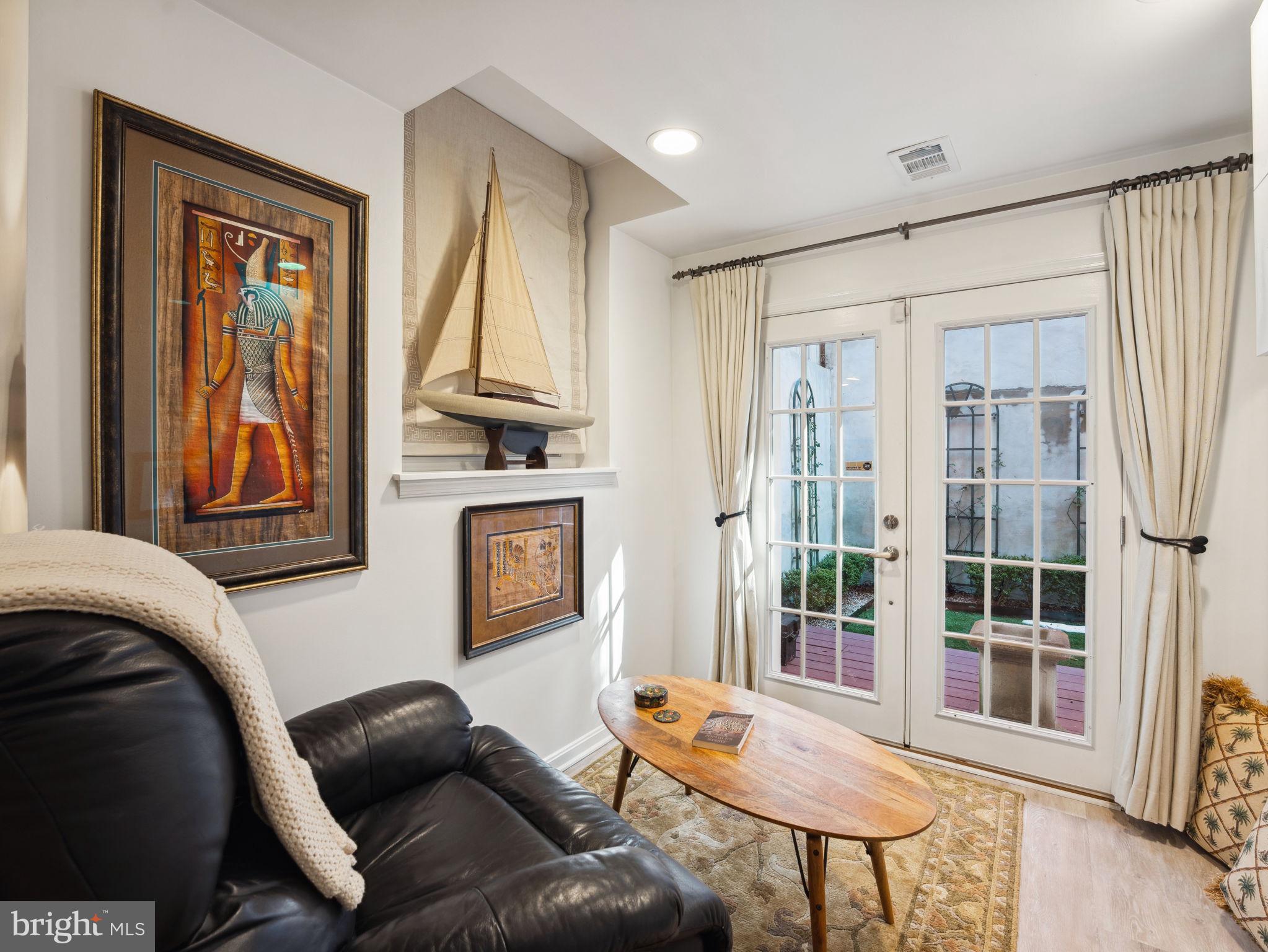 2001 19th Street Northwest, Unit 4 Washington, DC 20009 - Photo 30 of 42 a living room with furniture and a window