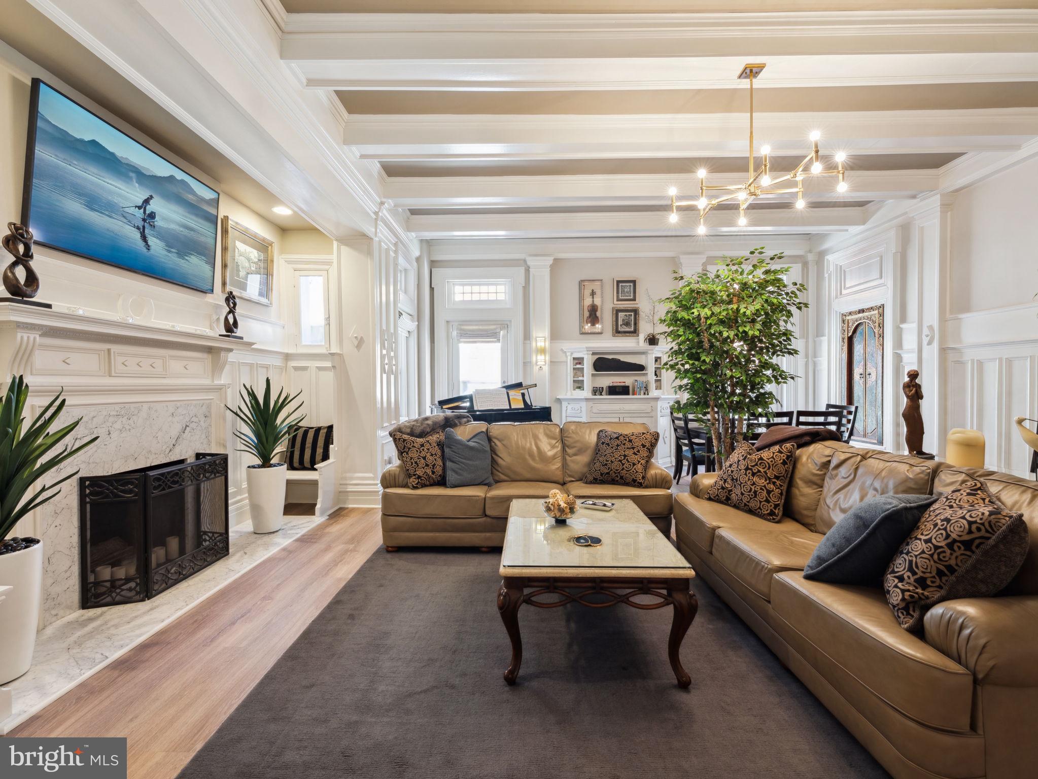 2001 19th Street Northwest, Unit 4 Washington, DC 20009 - Photo 3 of 42 a living room with furniture and a fireplace