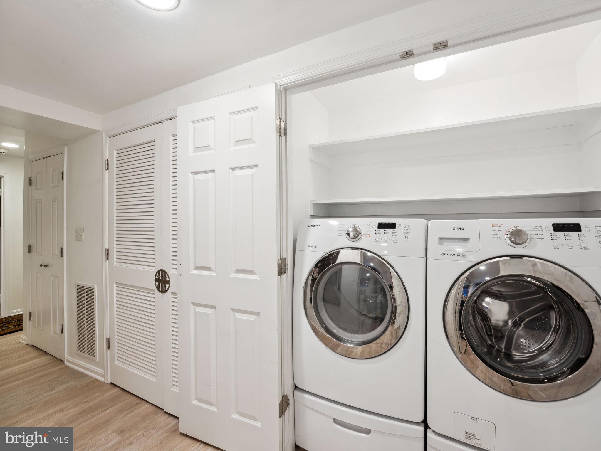 2001 19th Street Northwest, Unit 4 Washington, DC 20009 - Photo 35 of 42 a view of a hallway with washer and dryer