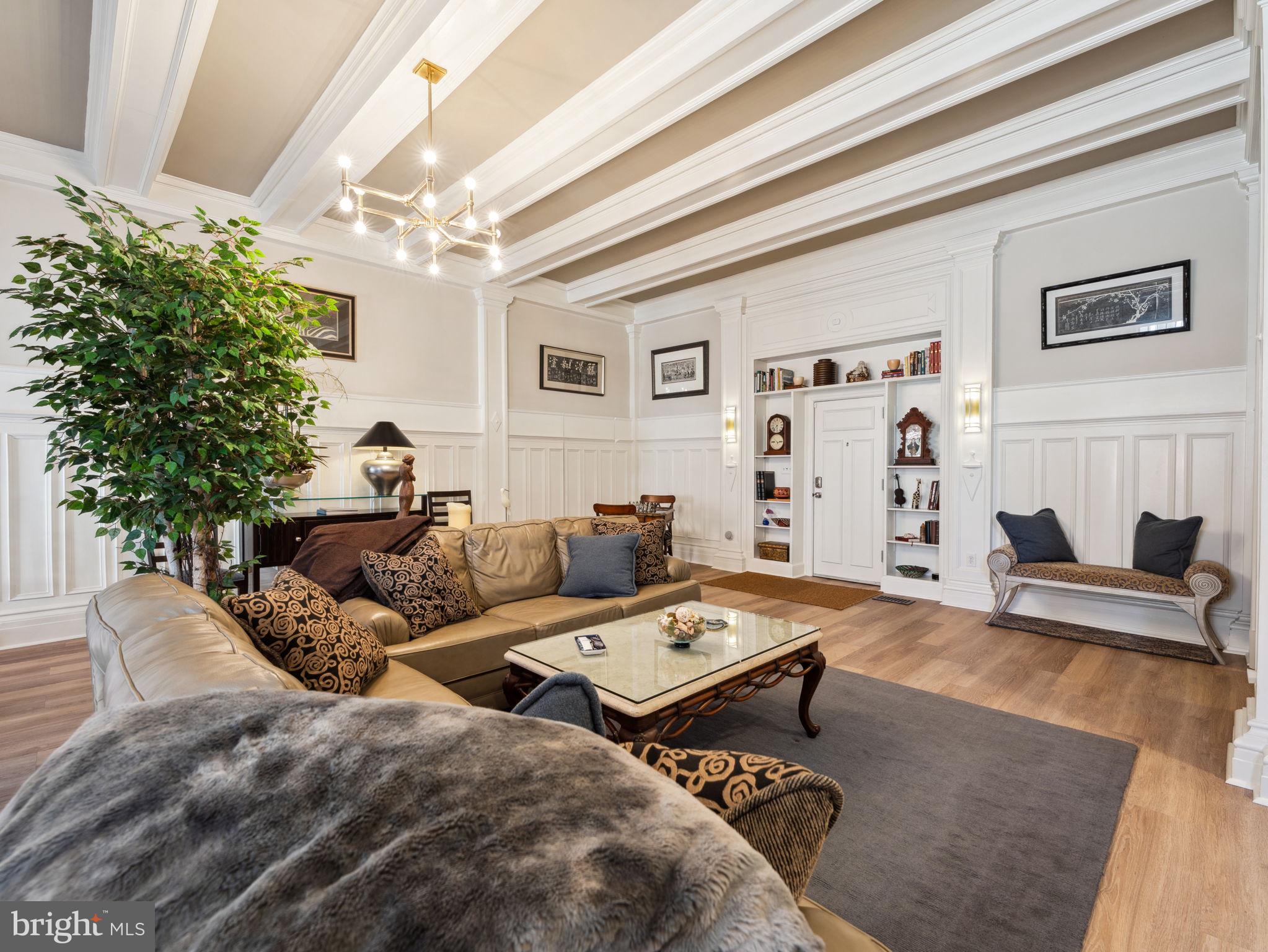 2001 19th Street Northwest, Unit 4 Washington, DC 20009 - Photo 4 of 42 a living room with furniture and a potted plant