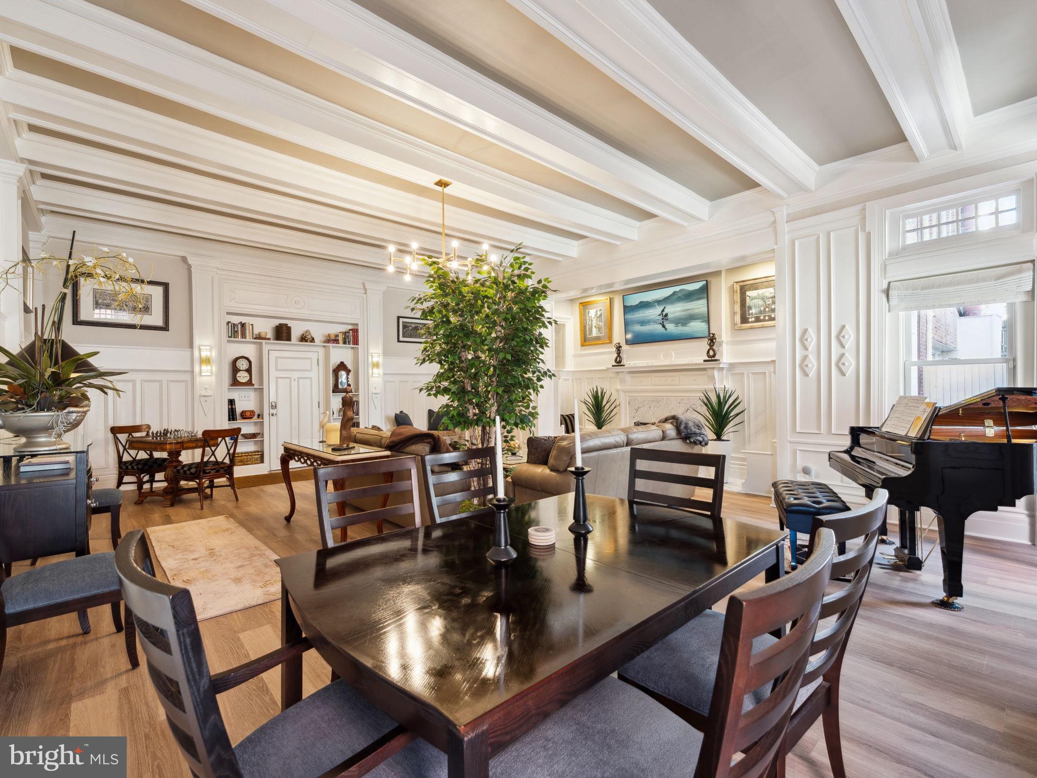 2001 19th Street Northwest, Unit 4 Washington, DC 20009 - Photo 8 of 42 a dining room with furniture a chandelier and wooden floor